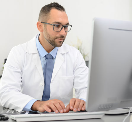 Male doctor on computer